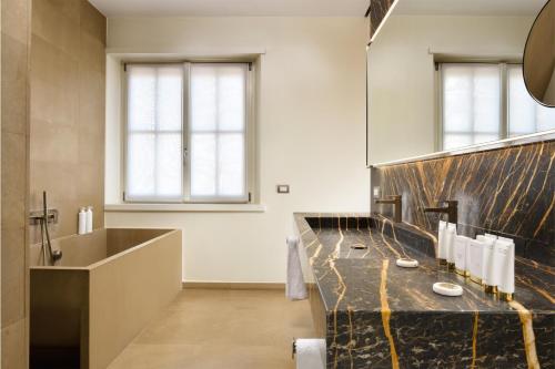 Habitación Premium Collection del hotel Palazzo Montemartini Rome, A Radisson Collection. Foto 1