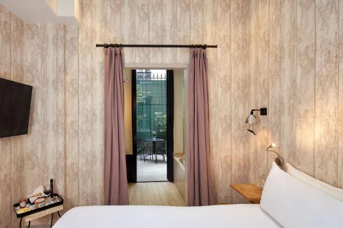 Habitación Doble Clásica con balcón o terraza del hotel Les Plumes. Foto 12