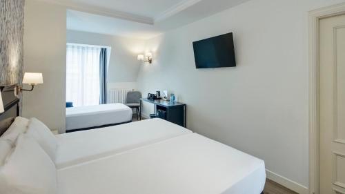 Habitación Doble con cama supletoria del hotel Sercotel Hotel Europa. Foto 2