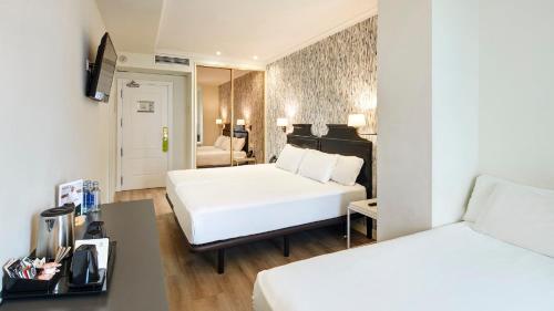 Habitación Doble con cama supletoria del hotel Sercotel Hotel Europa. Foto 3