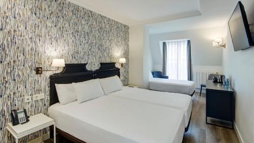 Habitación Doble con cama supletoria del hotel Sercotel Hotel Europa. Foto 4