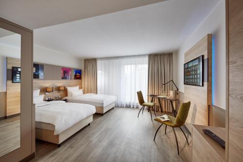 Habitación Doble Deluxe - 2 camas del hotel Lindner Dusseldorf Airport, Part Of Jdv By Hyatt. Foto 15