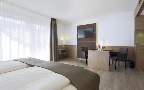 Habitación Premium con cama extragrande del hotel Lindner Dusseldorf Airport, Part Of Jdv By Hyatt. Foto 13