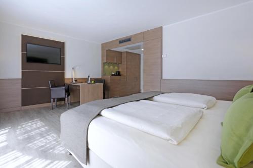 Estudio con cama extragrande del hotel Lindner Dusseldorf Airport, Part Of Jdv By Hyatt. Foto 12