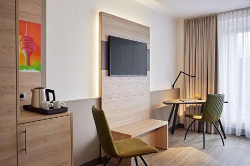 Habitación Doble Deluxe - 2 camas del hotel Lindner Dusseldorf Airport, Part Of Jdv By Hyatt. Foto 13