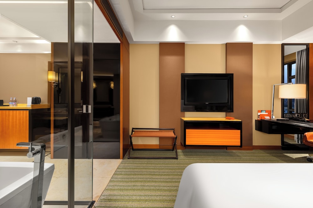 HABITACIÓN SUPERIOR con 1 cama king size del hotel Pullman Dongguan Changan. Foto 1