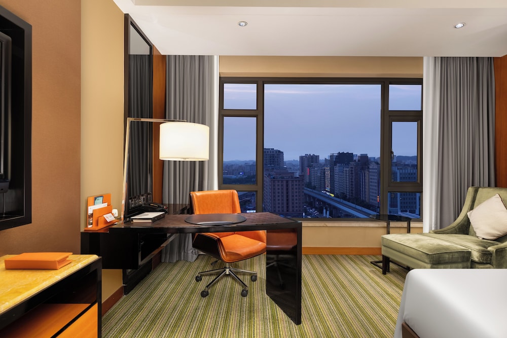 HABITACIÓN SUPERIOR con 1 cama king size del hotel Pullman Dongguan Changan. Foto 3