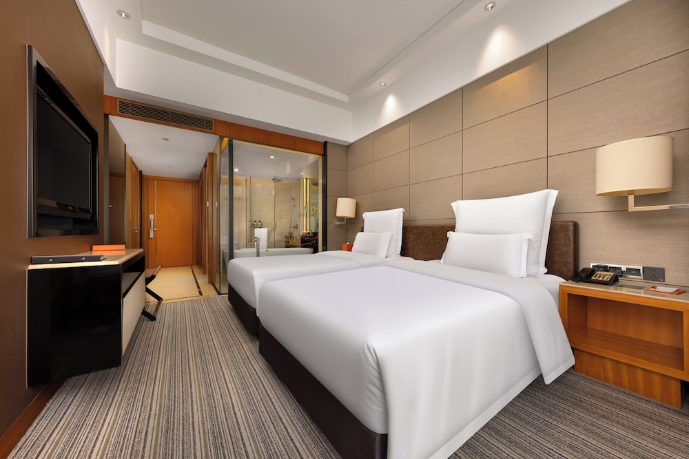Habitación superior con 2 camas individuales del hotel Pullman Dongguan Changan. Foto 4