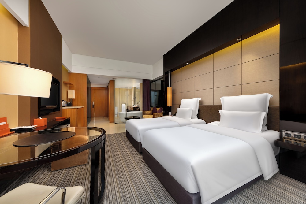 Habitación Deluxe con 2 camas individuales del hotel Pullman Dongguan Changan. Foto 4