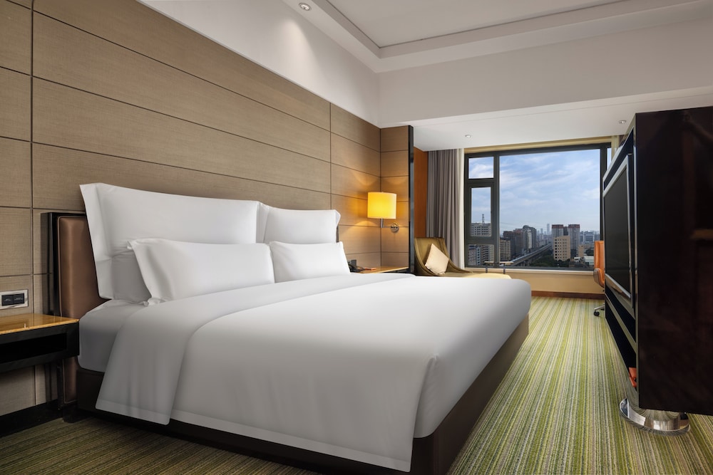 SUITE JUNIOR, 1 Cama King Size del hotel Pullman Dongguan Changan. Foto 2