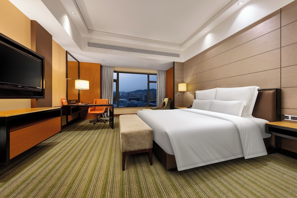 Suite Deluxe con 1 cama King Size del hotel Pullman Dongguan Changan. Foto 1
