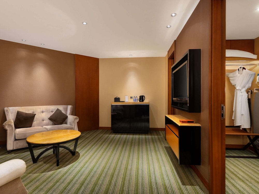 Suite Deluxe con 1 cama King Size del hotel Pullman Dongguan Changan. Foto 6