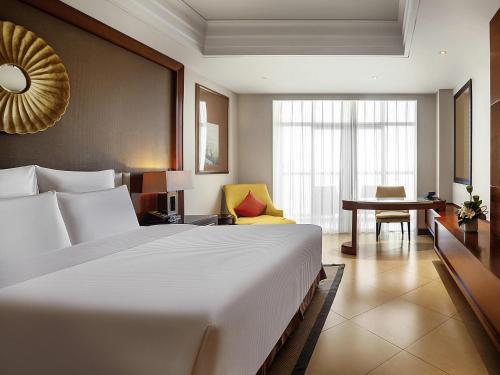 Habitación Executive King con balcón privado y vistas al mar - Acceso al lounge del hotel Pullman Haikou. Foto 4