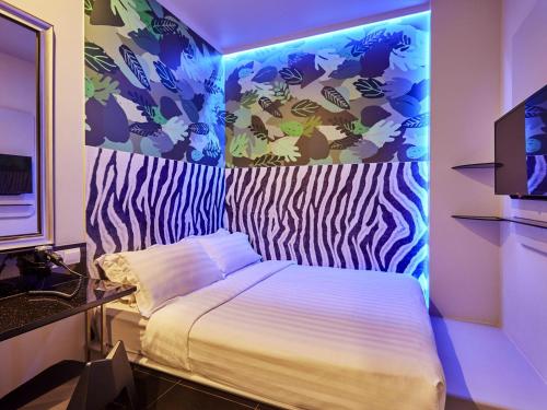 Habitación temática estándar con 1 cama doble del hotel Ibis Budget Singapore Bugis (sg Clean). Foto 2