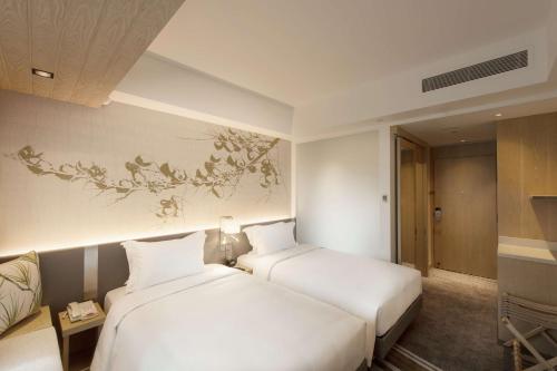 Habitación Familiar Deluxe del hotel Hilton Garden Inn Singapore Serangoon. Foto 1