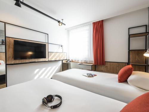 Habitación Doble Estándar - 2 camas del hotel ibis Lyon Sud Oullins. Foto 3