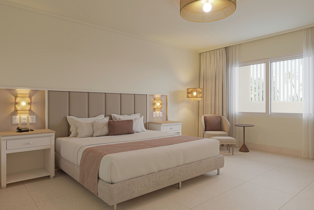Habitación estándar, 1 cama King (Vista Tropical) del hotel Wyndham Alltra Punta Cana All-Inclusive Resort. Foto 1