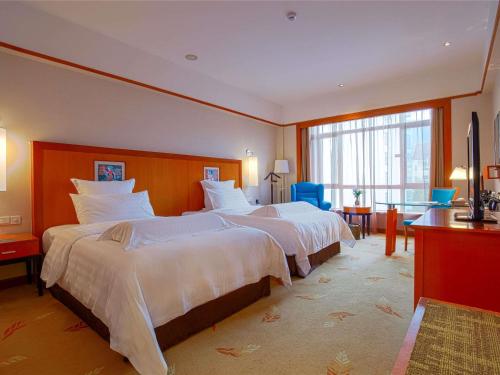 Habitación Doble Deluxe Executive con acceso al salón - 2 camas del hotel Pullman Zhangjiajie. Foto 3