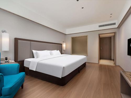 Habitación Premium Deluxe con cama extragrande del hotel Pullman Zhangjiajie. Foto 2