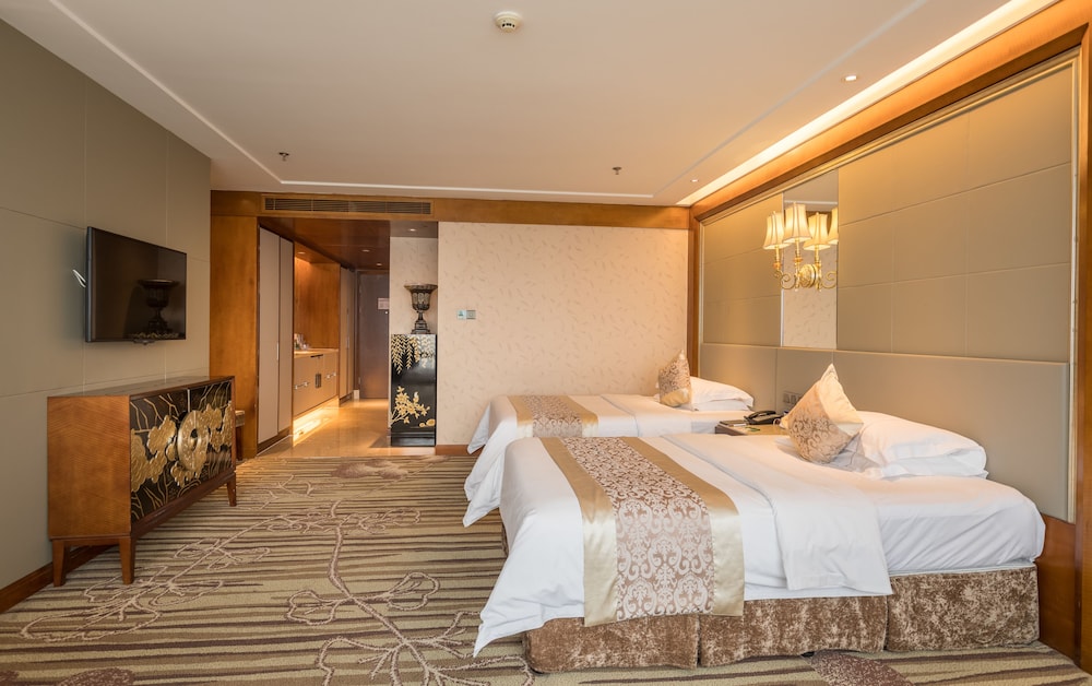 Habitación superior con 2 camas individuales del hotel Sunshine Zhangjiajie. Foto 1