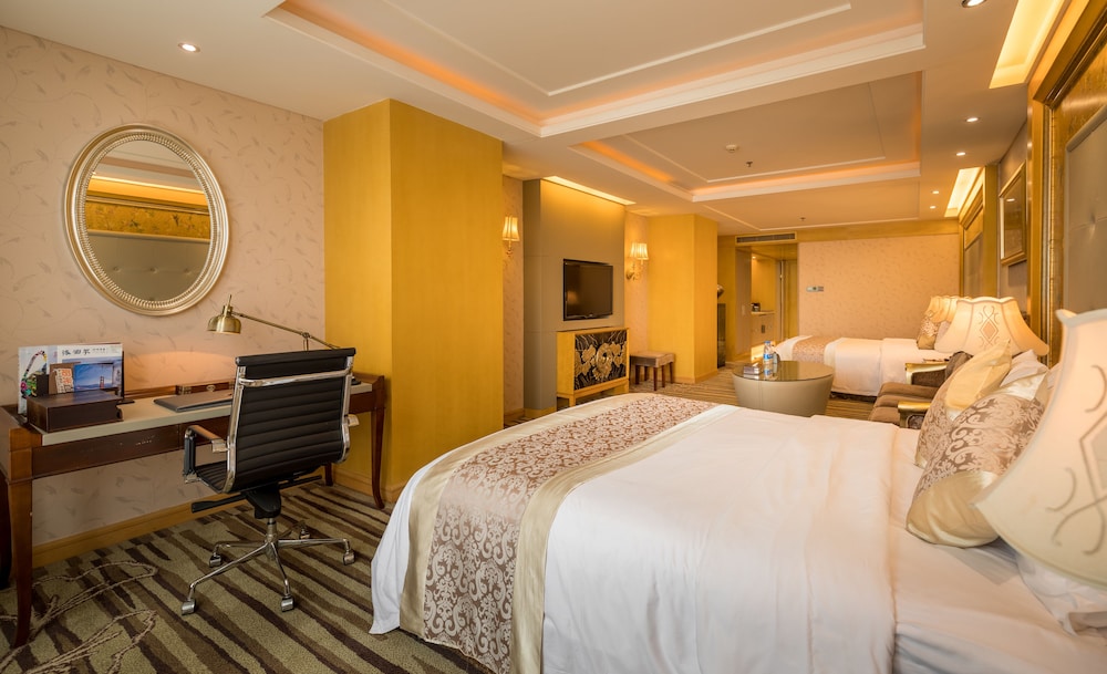Habitación familiar con dos camas dobles del hotel Sunshine Zhangjiajie. Foto 2