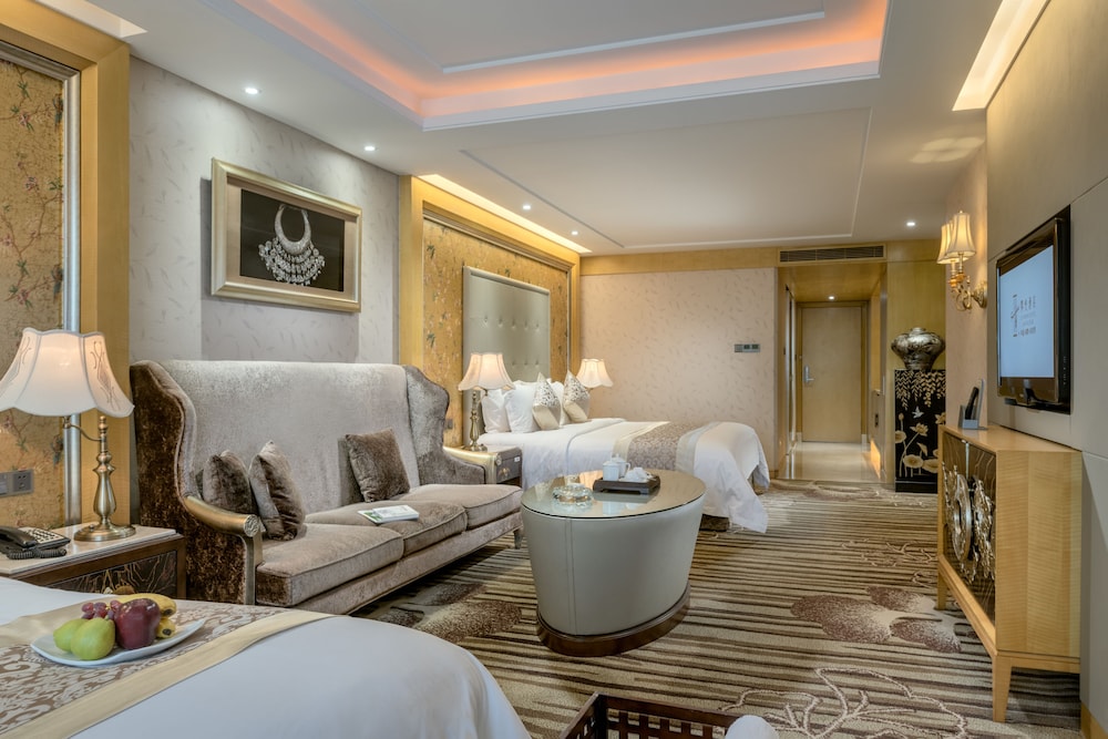 Habitación familiar con dos camas dobles del hotel Sunshine Zhangjiajie. Foto 4