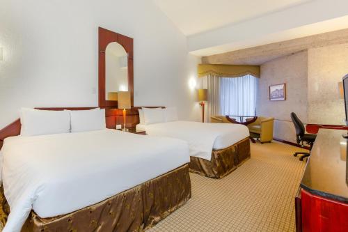 Habitación Doble Estándar con 2 camas grandes del hotel Radisson San Jose-costa Rica. Foto 1