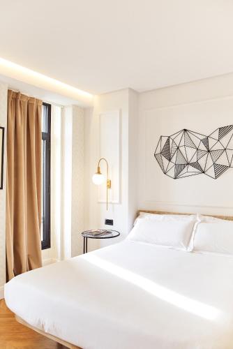 Habitación Doble con cama supletoria del hotel Occidental León Alfonso V. Foto 3