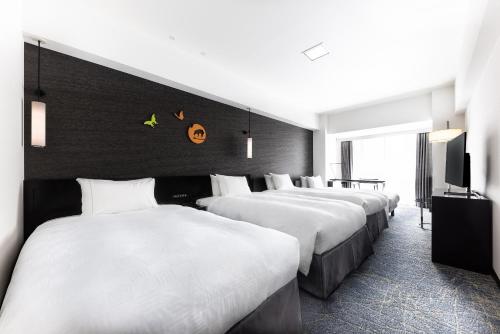 Habitación Deluxe Esquinera (2 camas individuales + 2 cama supletoria) del hotel The Royal Park Kyoto Sanjo. Foto 2
