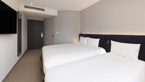 Habitación Doble Premium con cama individual del hotel Ibis Ambassador Seoul Insadong. Foto 3