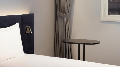 Habitación Triple Premium con 3 camas individuales del hotel Ibis Ambassador Seoul Insadong