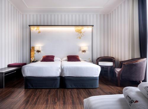 Habitación Doble con cama supletoria - 1 o 2 camas del hotel Intur Palacio San Martin