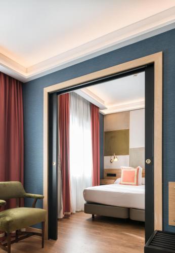 Habitación Familiar del hotel Principe Pio. Foto 10