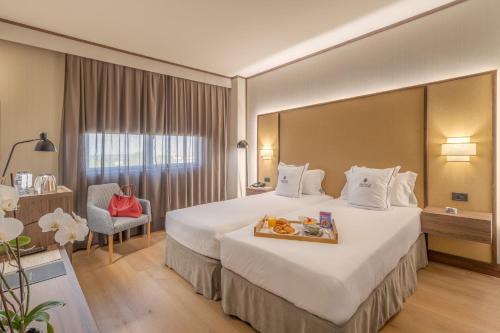 Habitación Triple Superior del hotel Aravaca Village. Foto 4