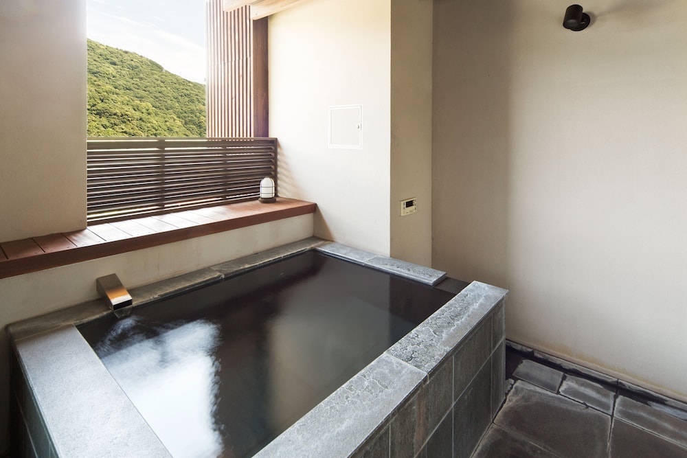 Habitación con 2 camas individuales (w/Private Open - airBath only13yrsAbove) del hotel Aura Tachibana. Foto 5