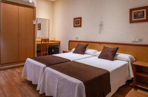 Habitación Doble Económica del hotel Mediodia. Foto 6