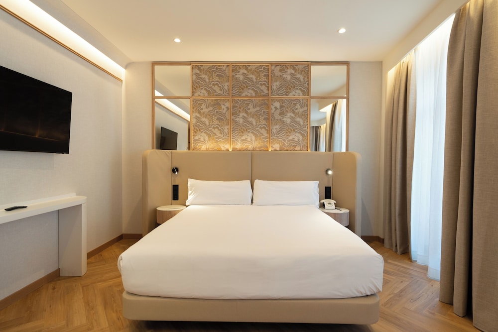 Habitación Cuádruple del hotel Petit Palace Chueca. Foto 1