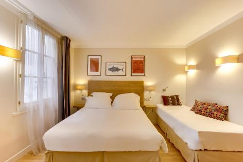 Habitación Triple Confort del hotel Louvre Richelieu. Foto 6