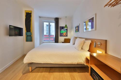 Habitación Triple Confort del hotel Louvre Richelieu. Foto 7