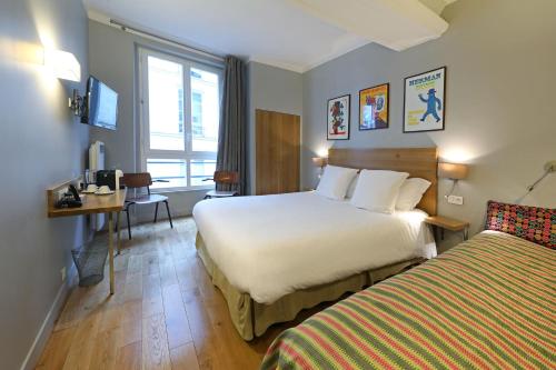 Habitación Triple Confort del hotel Louvre Richelieu. Foto 14