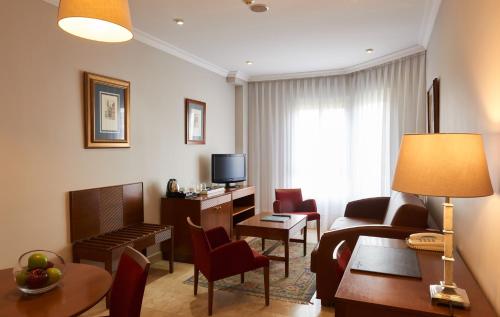 Habitación Triple del hotel Barrio De Salamanca Suites. Foto 4