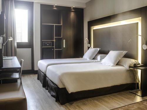 Habitación Doble Estándar - 2 camas del hotel Novotel Madrid Center. Foto 1