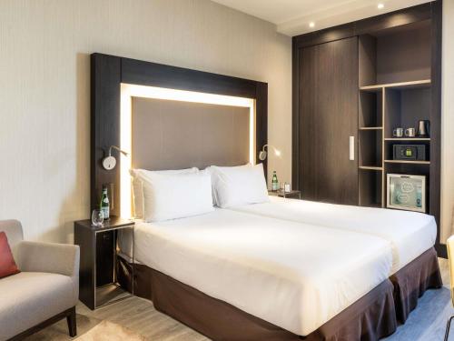 Habitación Doble Estándar - 2 camas del hotel Novotel Madrid Center. Foto 7