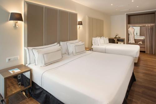 Habitación Familiar del hotel Melia Madrid Serrano. Foto 1