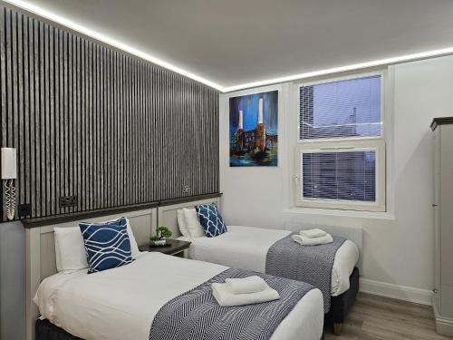 Habitación Doble - 2 camas del hotel London Stay Apartments. Foto 2