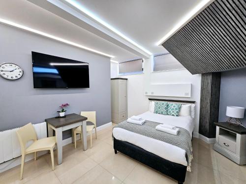 Habitación Doble del hotel London Stay Apartments. Foto 7