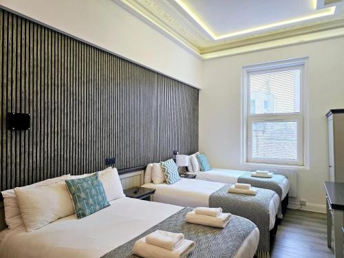 Habitación cuádruple del hotel London Stay Apartments. Foto 3