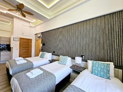 Habitación cuádruple del hotel London Stay Apartments. Foto 4