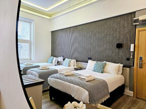 Habitación cuádruple del hotel London Stay Apartments. Foto 5