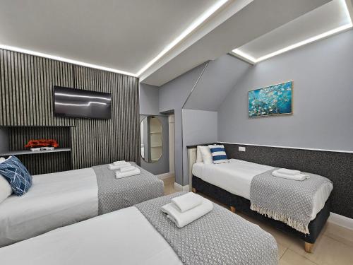 Habitación cuádruple del hotel London Stay Apartments. Foto 7